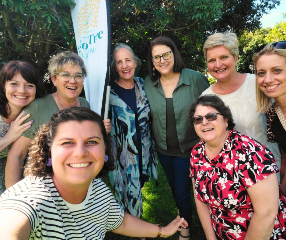 Yellow Tree Reading community of educators smiling together outdoors