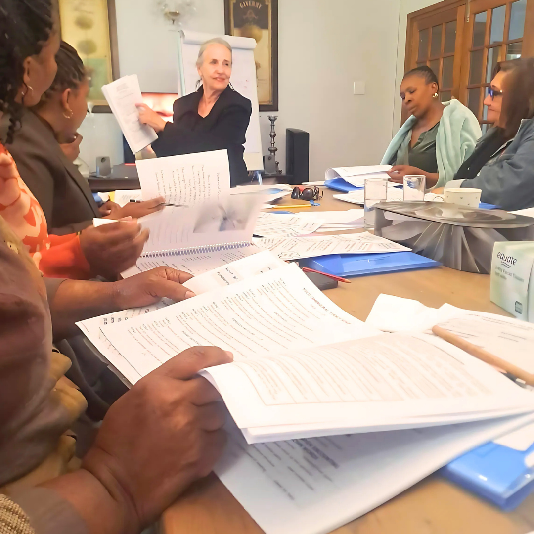 Delegates working through course notes during a training session